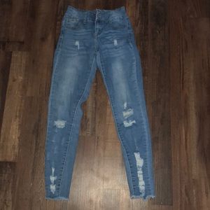 light wash denim distressed jeans
